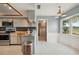 Kitchen with gray cabinets, tile floors, and a breakfast bar at 31226 Saint Joe Rd, Dade City, FL 33525
