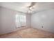 Bright bedroom with ceiling fan and carpet flooring at 31226 Saint Joe Rd, Dade City, FL 33525