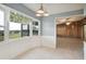 Kitchen with white cabinets and a view of a pastoral landscape at 31226 Saint Joe Rd, Dade City, FL 33525