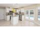 Updated kitchen featuring white cabinets, granite counters and island at 1553 Scotch Pine Dr, Brandon, FL 33511