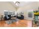 Vaulted ceiling living room with hardwood floors and ample natural light at 1553 Scotch Pine Dr, Brandon, FL 33511
