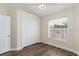 Bright bedroom with double closet and wood-look flooring at 1553 Scotch Pine Dr, Brandon, FL 33511