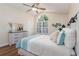 Bright bedroom with vaulted ceiling, large window, and hardwood floors at 1553 Scotch Pine Dr, Brandon, FL 33511