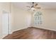 Bright bedroom with hardwood floors and large arched window at 1553 Scotch Pine Dr, Brandon, FL 33511