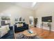 Spacious living room with hardwood floors and comfortable seating at 1553 Scotch Pine Dr, Brandon, FL 33511