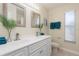 Double vanity bathroom with updated fixtures and a shower/tub combo at 1553 Scotch Pine Dr, Brandon, FL 33511