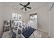 Charming bedroom with a comfortable bed and window seat at 404 Grand Chateaux Way, Sun City Center, FL 33573