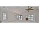 Spacious living area with high ceilings and large windows at 404 Grand Chateaux Way, Sun City Center, FL 33573