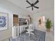 Home office with built-in shelving and a workspace at 404 Grand Chateaux Way, Sun City Center, FL 33573