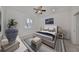 Relaxing bedroom with a plush bed and calming decor at 404 Grand Chateaux Way, Sun City Center, FL 33573
