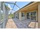 Screened patio with brick pavers and access to house at 404 Grand Chateaux Way, Sun City Center, FL 33573