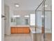 Well-lit bathroom featuring a soaking tub and double vanity at 404 Grand Chateaux Way, Sun City Center, FL 33573
