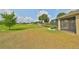 Large backyard with a view of the golf course at 404 Grand Chateaux Way, Sun City Center, FL 33573
