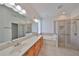Clean bathroom with double sinks and a large shower at 404 Grand Chateaux Way, Sun City Center, FL 33573