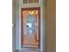Inviting entryway with a red door and tile flooring at 404 Grand Chateaux Way, Sun City Center, FL 33573