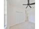 Spacious bedroom with ceiling fan and double door closet at 404 Grand Chateaux Way, Sun City Center, FL 33573