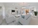Bright living room featuring comfortable seating and an open floor plan at 404 Grand Chateaux Way, Sun City Center, FL 33573