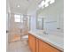 Clean bathroom with walk-in shower, toilet and vanity at 404 Grand Chateaux Way, Sun City Center, FL 33573