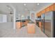 Kitchen with light wood cabinets and stainless steel appliances at 404 Grand Chateaux Way, Sun City Center, FL 33573