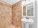 Clean bathroom with a pedestal sink and a large shower at 3005 Ybor St, Tampa, FL 33605