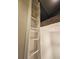 White wooden ladder leading to loft bedroom at 11310 Stratton Park Dr # 1, Temple Terrace, FL 33617