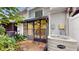 View of back patio with screened enclosure, leading to the kitchen at 11310 Stratton Park Dr # 1, Temple Terrace, FL 33617