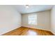 Well-lit bedroom with hardwood floors and window at 11310 Stratton Park Dr # 1, Temple Terrace, FL 33617