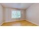 Bright bedroom with hardwood floors and a window at 11310 Stratton Park Dr # 1, Temple Terrace, FL 33617