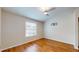 Well-lit bedroom showcasing wood floors and a ceiling fan at 11310 Stratton Park Dr # 1, Temple Terrace, FL 33617