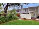 Private backyard with green grass and white fence at 11310 Stratton Park Dr # 1, Temple Terrace, FL 33617