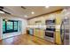 Modern kitchen with stainless steel appliances and view of screened porch at 11310 Stratton Park Dr # 1, Temple Terrace, FL 33617