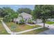 Inviting single-Gathering home with lush landscaping, a manicured lawn, and ample parking at 12902 Cattail Shore Ln, Riverview, FL 33579