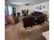 Comfortable living room with brown leather furniture and large TV at 812 Tidal Rock Ave, Ruskin, FL 33570