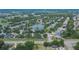 Wide aerial view of a residential area with a lake at 12902 Cattail Shore Ln, Riverview, FL 33579