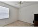 Well-lit bedroom with window and neutral colored walls at 12902 Cattail Shore Ln, Riverview, FL 33579