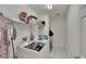 Laundry room with washer, dryer and shelving at 12902 Cattail Shore Ln, Riverview, FL 33579