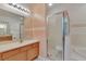 Bathroom features a shower, double vanity, and tile floors at 12902 Cattail Shore Ln, Riverview, FL 33579