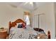 Bedroom with double bed and ceiling fan at 12902 Cattail Shore Ln, Riverview, FL 33579