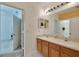 Double vanity bathroom with wood cabinets at 12902 Cattail Shore Ln, Riverview, FL 33579