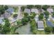 Bird's-eye view of neighborhood with pond and houses at 12902 Cattail Shore Ln, Riverview, FL 33579