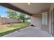 Covered patio overlooking a fenced backyard with grassy area at 12902 Cattail Shore Ln, Riverview, FL 33579