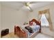 Bedroom with double bed and ceiling fan at 12902 Cattail Shore Ln, Riverview, FL 33579