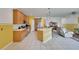 Kitchen with wood cabinets, island, and stainless steel appliances at 12902 Cattail Shore Ln, Riverview, FL 33579