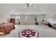 Large main bedroom with multiple windows and ceiling fan at 12902 Cattail Shore Ln, Riverview, FL 33579