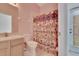 Bathroom with shower and patterned curtain at 12902 Cattail Shore Ln, Riverview, FL 33579