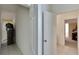 Clean hallway with tile flooring and access to other rooms at 12902 Cattail Shore Ln, Riverview, FL 33579