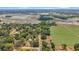 Aerial view showing home's location near a farm and lake at 2601 N Wilder Loop, Plant City, FL 33565