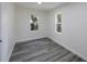 Well-lit bedroom featuring wood-look floors and neutral walls at 2601 N Wilder Loop, Plant City, FL 33565