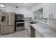 Modern kitchen with stainless steel appliances and white cabinets at 2601 N Wilder Loop, Plant City, FL 33565