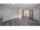 Bright hallway with wood-look floors and access to other rooms at 2601 N Wilder Loop, Plant City, FL 33565